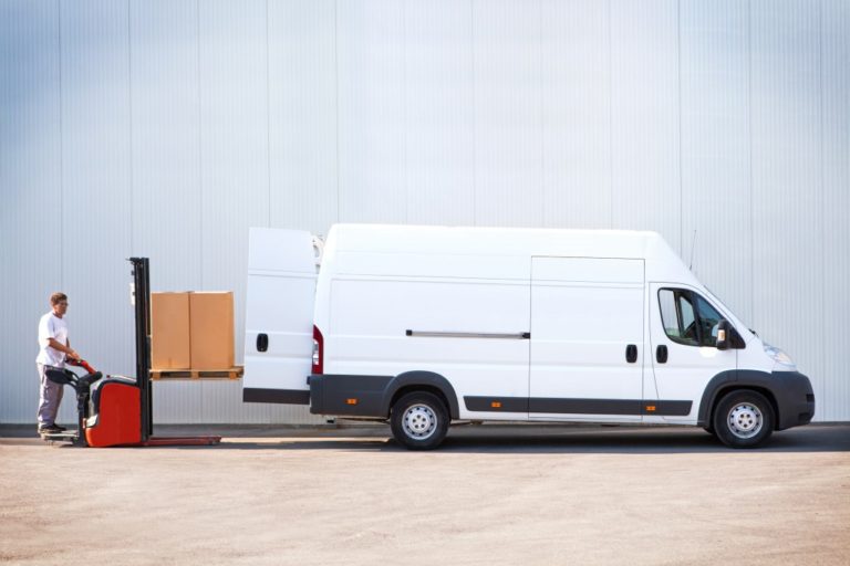 Worker loading packages in a sprinter van