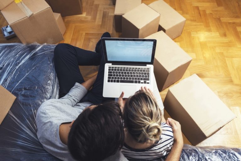 Couple checking the laptop