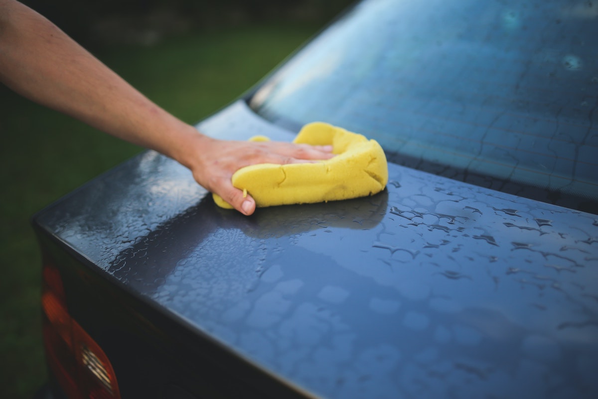 cleaning the car with sponge