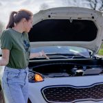 a woman with a car issue