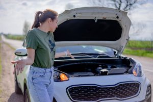 a woman with a car issue